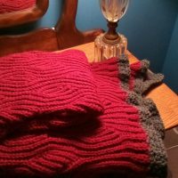 folded afghan under lamp